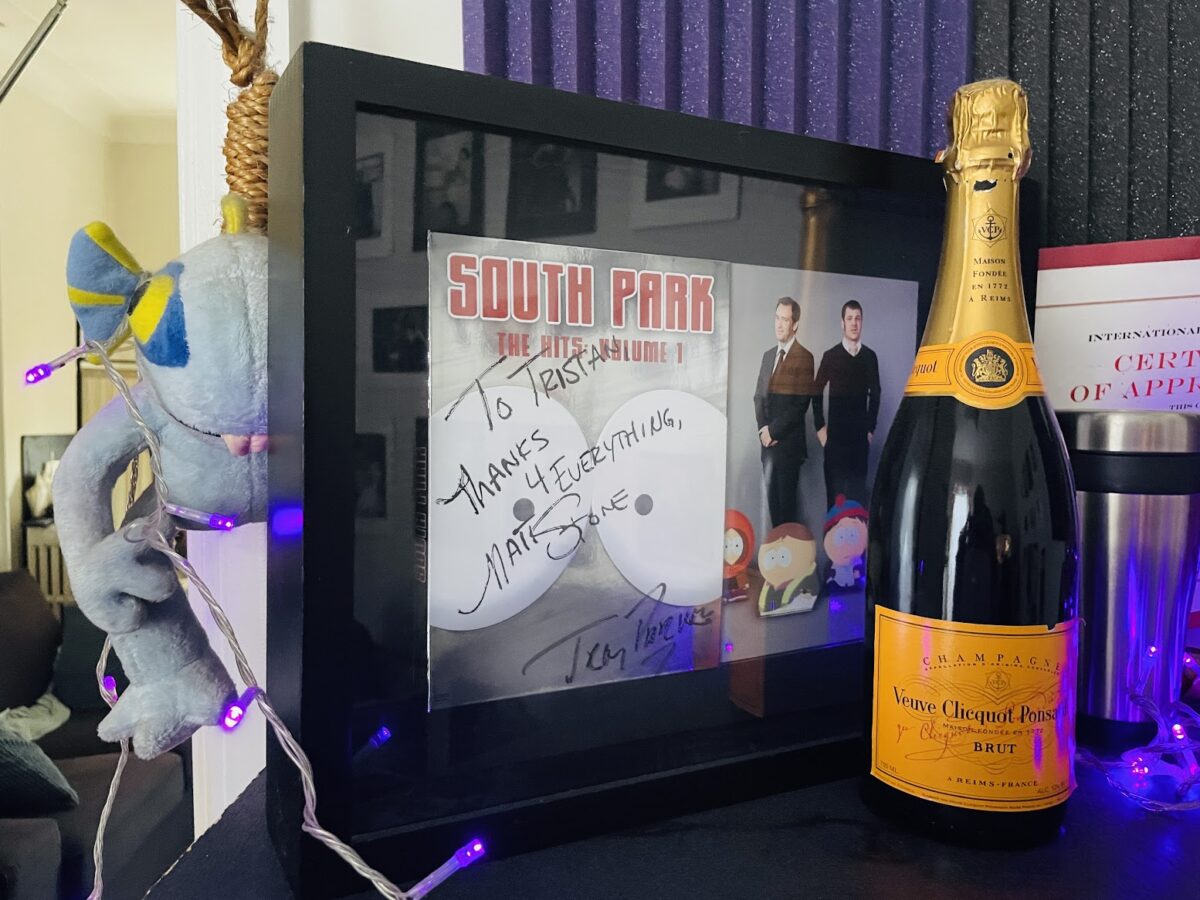 Signed DVD and champagne from the team